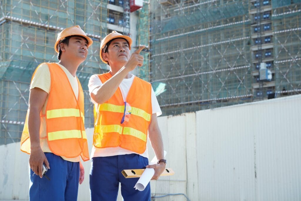 Contractors Discussing Exterior Wall Finish
