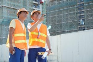 Contractors Discussing Exterior Wall Finish